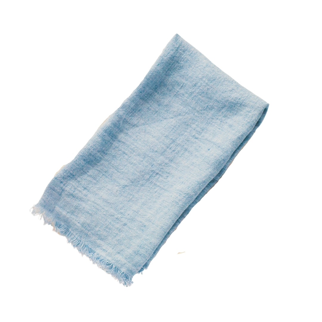 20-inch square stonewashed linen napkins with fringe edge shown in denim blue
