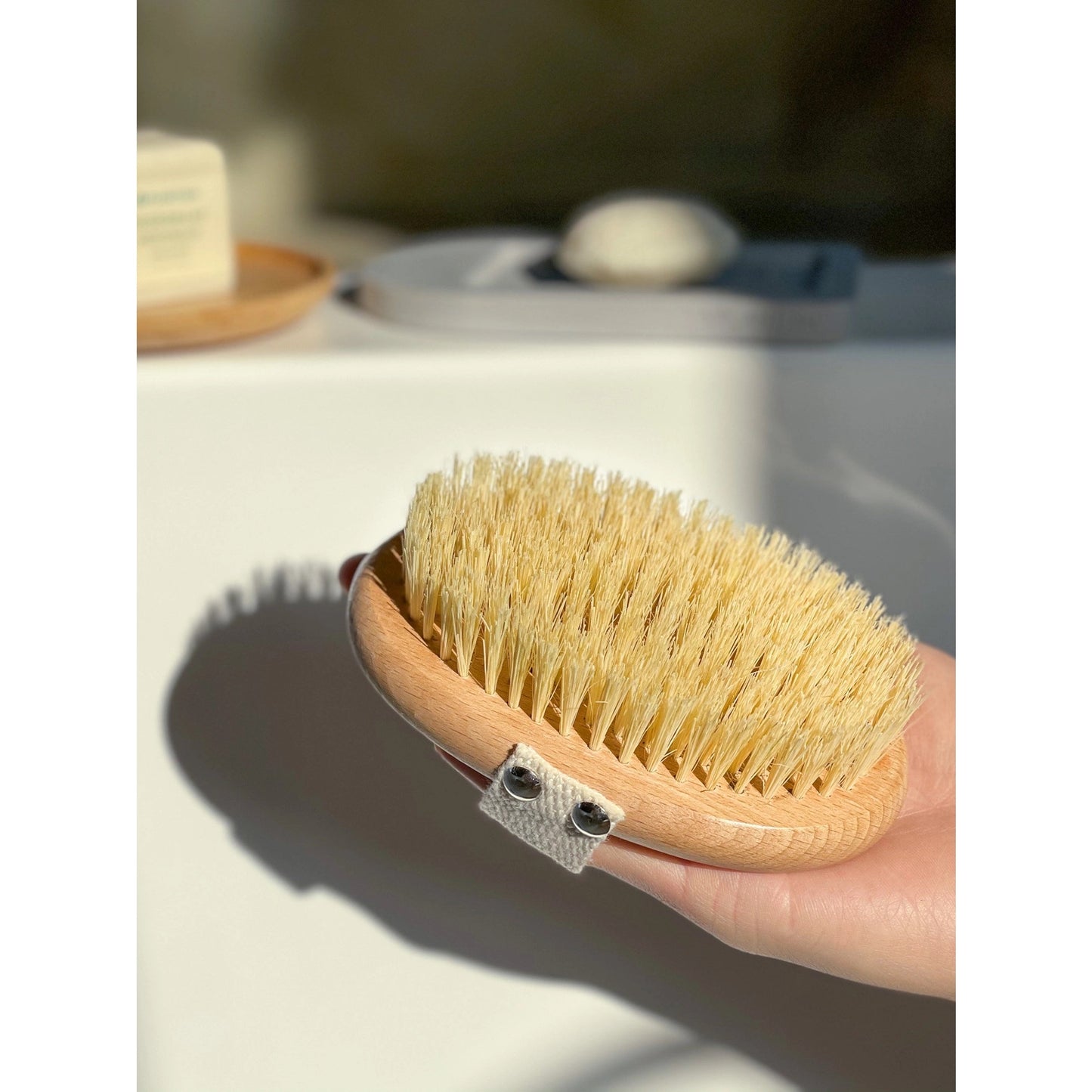 dry body brush with hand in strap