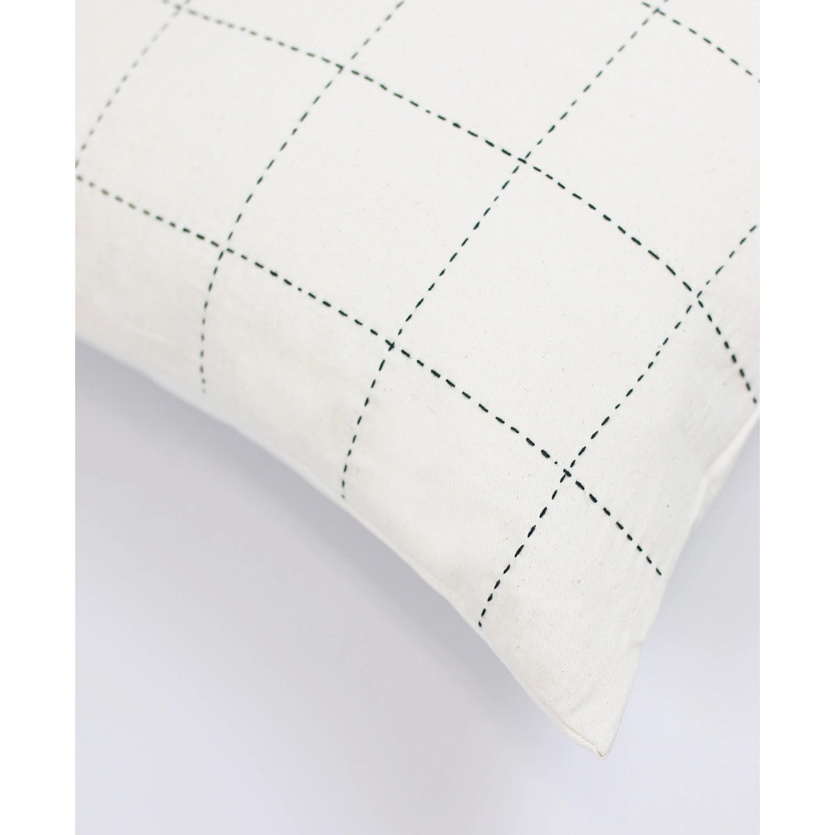 22" square hand-embroidered organic cotton pillow filled with goose down and duck feather shown in bone white with black stitching
