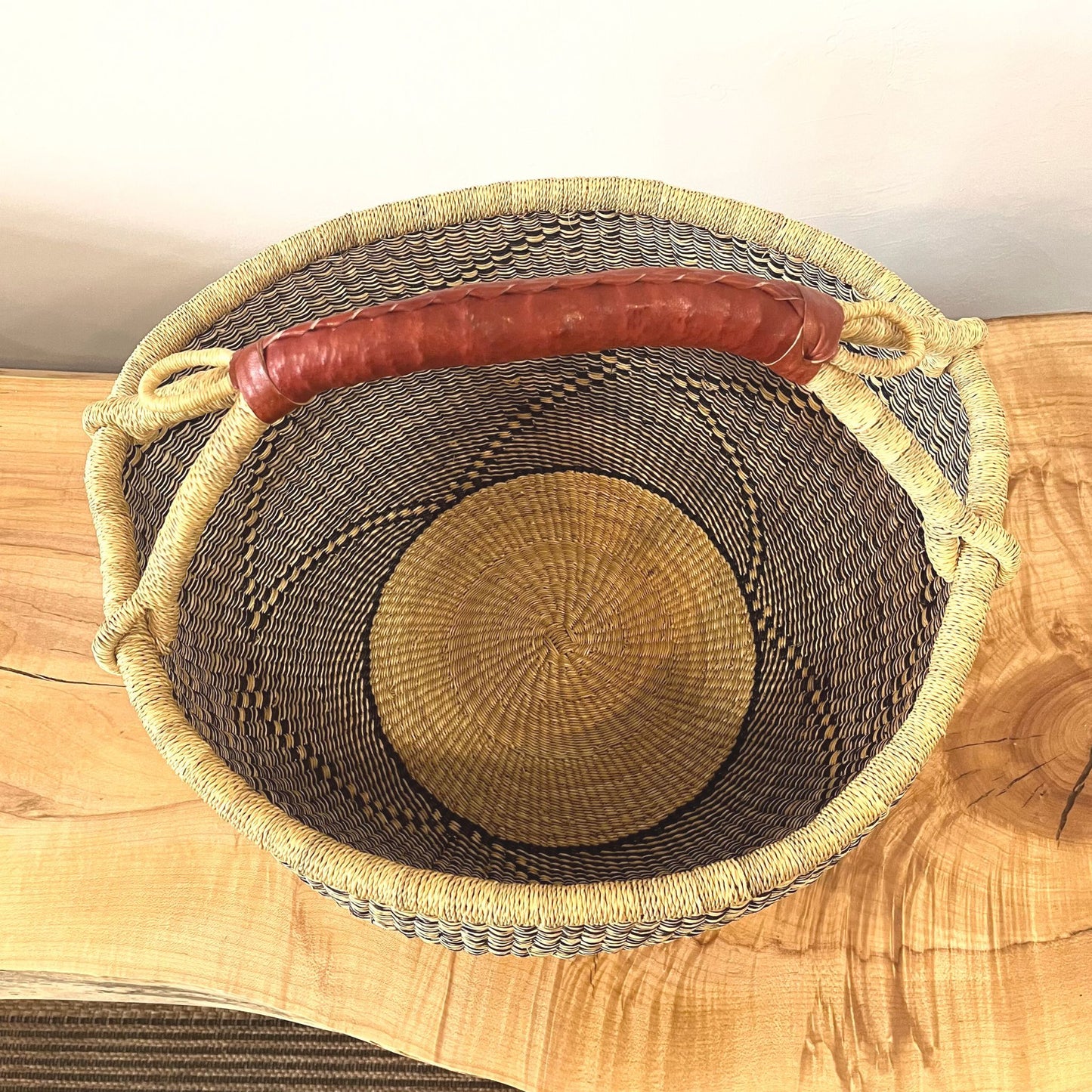 Inside of large patterned handwoven Bolga basket