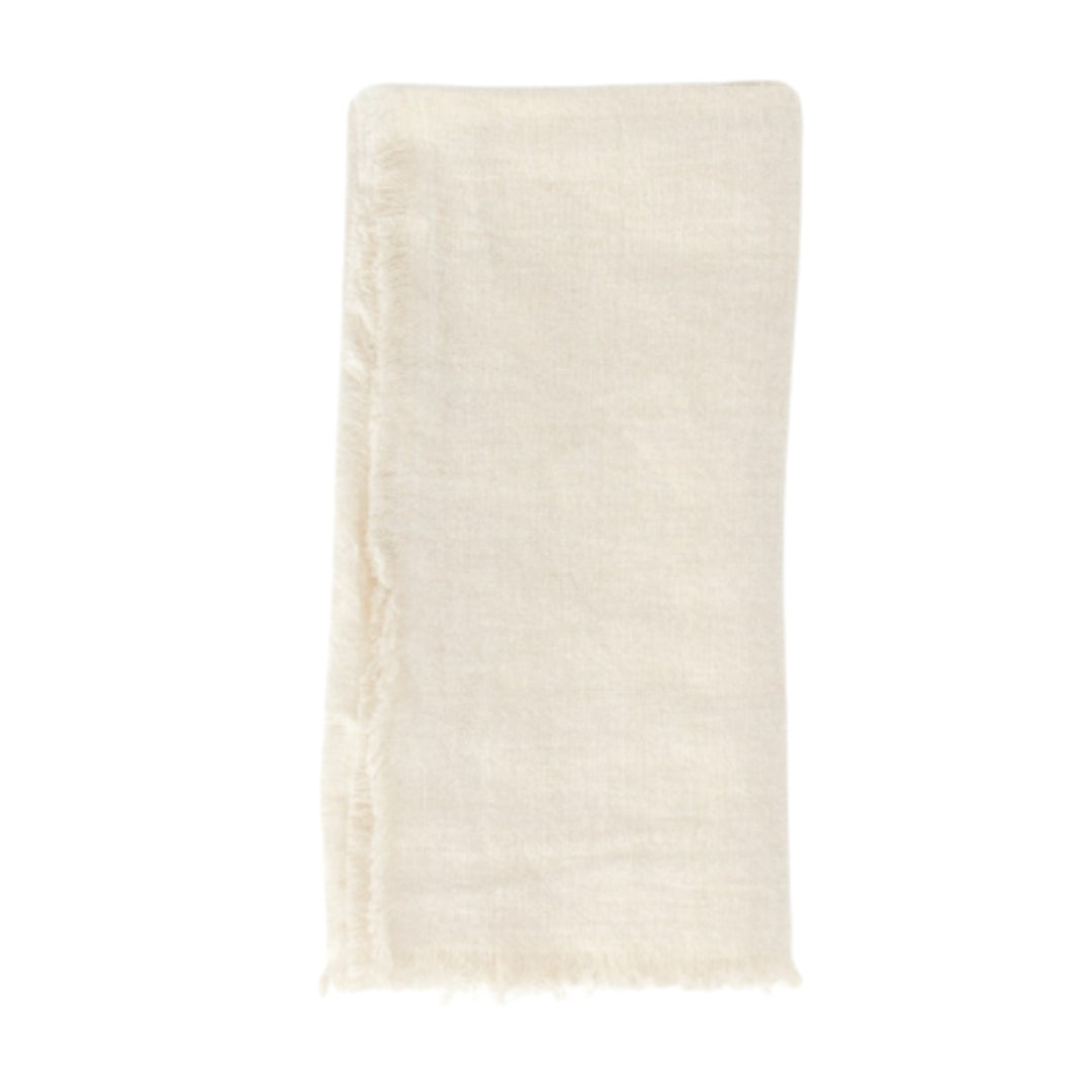 20-inch square stonewashed linen napkin with fringe edge shown in ivory