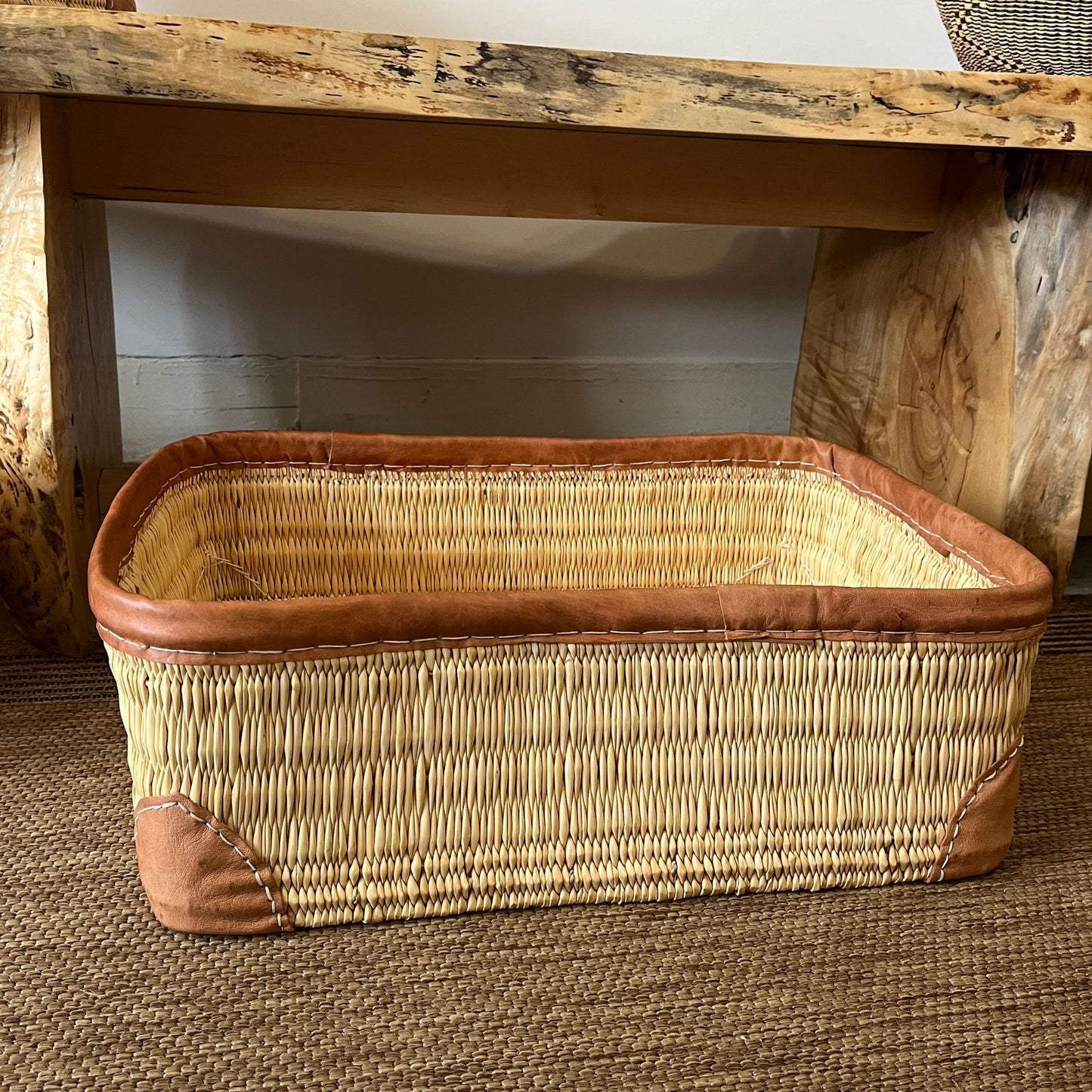 Large woven palm and leather-trimmed rectangular storage basket