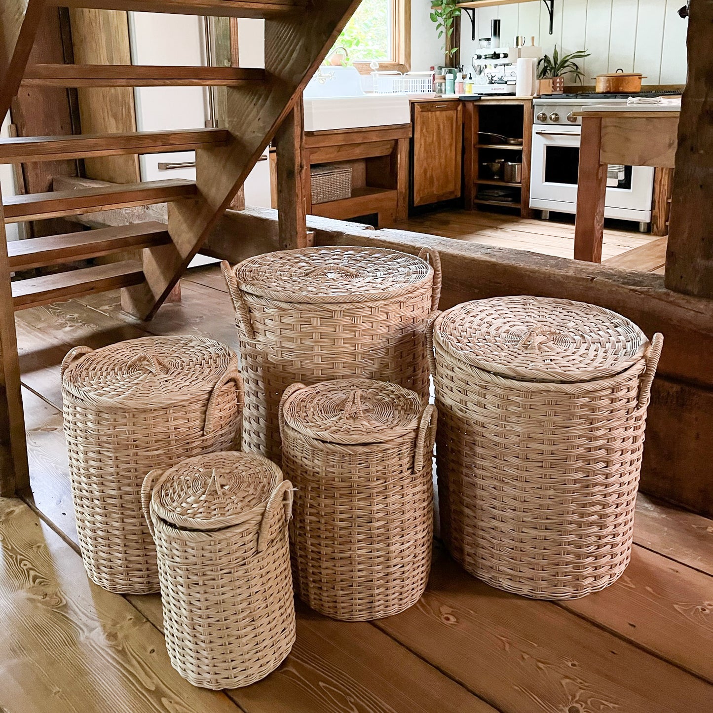 Various sizes of lidded rattan storage basket with handles