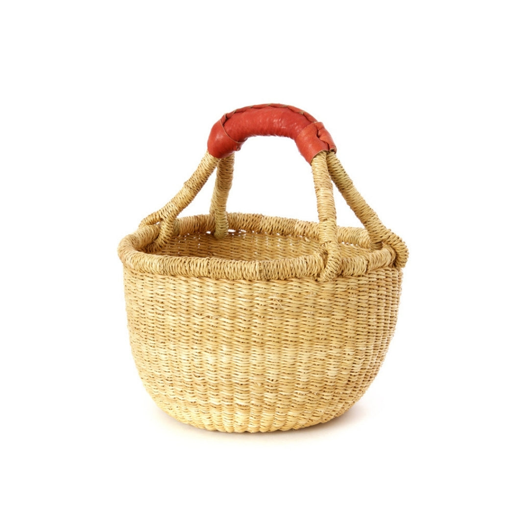 small undyed natural bolga basket with tan leather handle