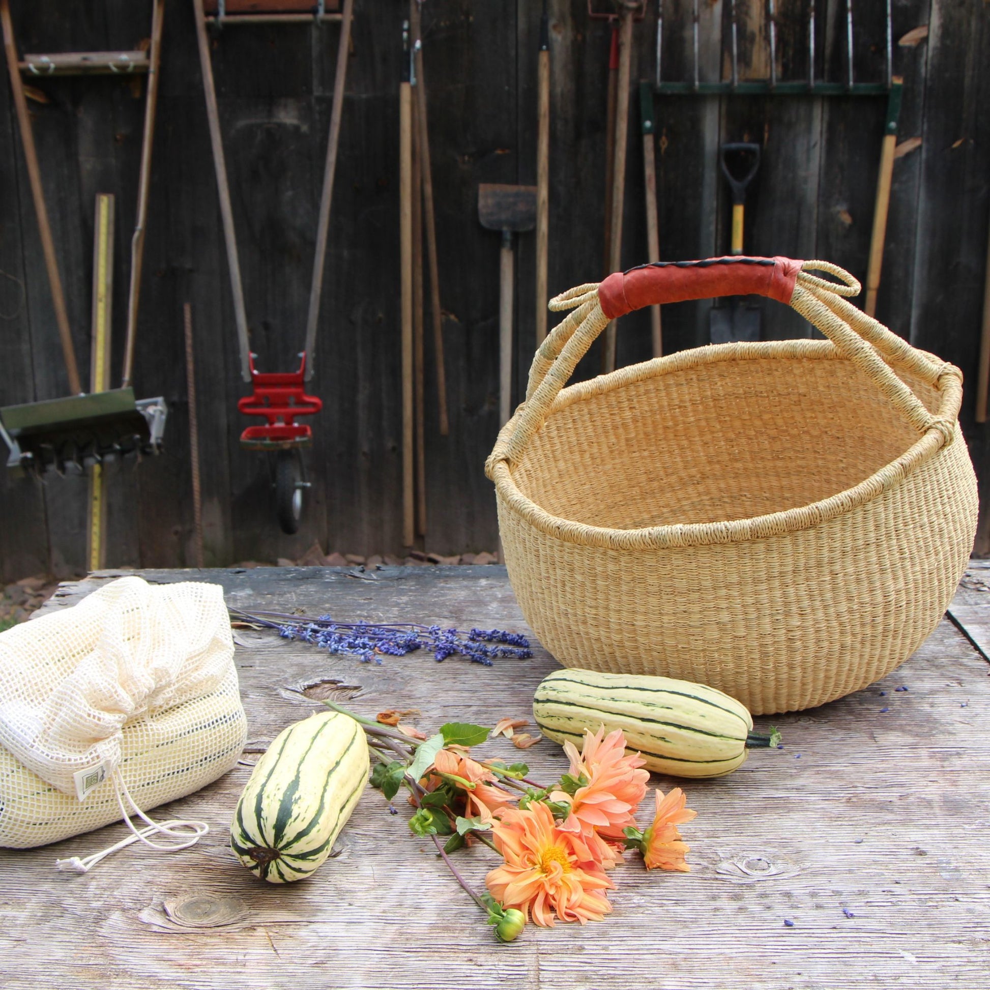 natural bolga basket with produce, squash and flowers
