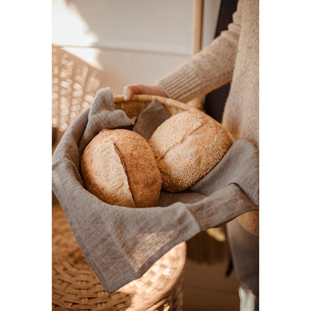 20-inch square stonewashed linen napkins with hemmed edge shown lining a bread basket