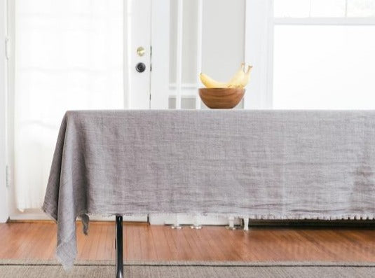 84 x 60 inch soft stonewashed linen table cloth with fringe edge shown in oyster gray