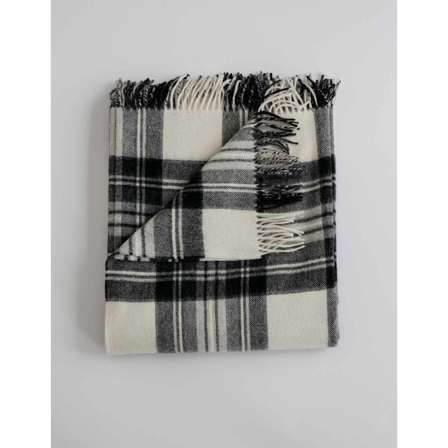 Cozy 100% Merino Lambswool throw blanket in black and pearl check pattern
