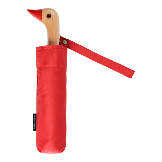 Compact umbrella in red with birchwood handle in the shape of duck head