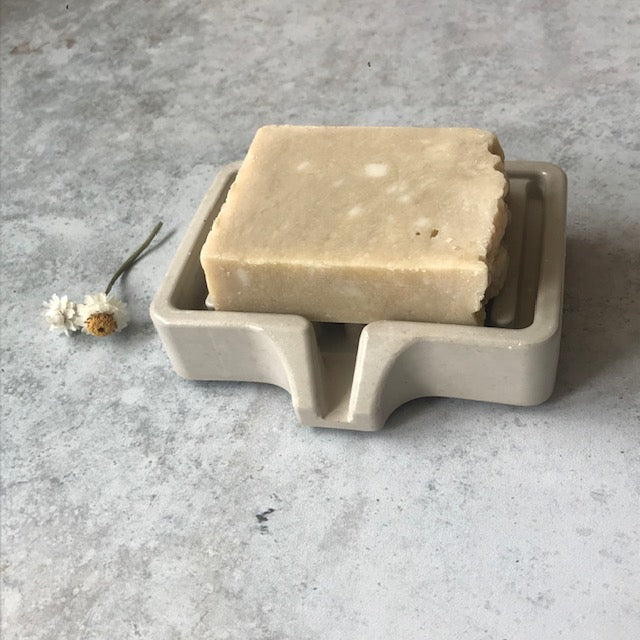 Concrete Soap Dish with Drain and a soap on it