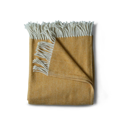 Brushed cotton throw blanket in yellow herringbone pattern with cotton fringe