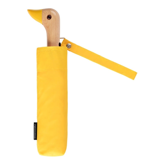 Compact umbrella in bright yellow with birchwood handle in the shape of duck head
