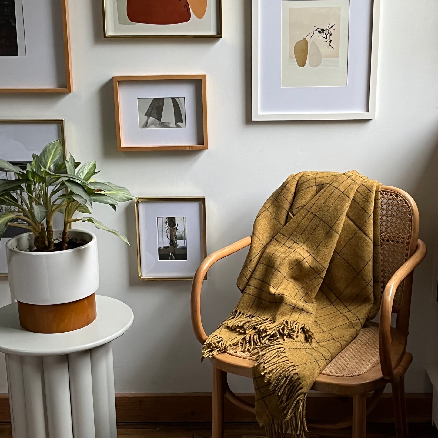Cozy 100% Merino Lambswool throw blanket in honey color draped on armchair