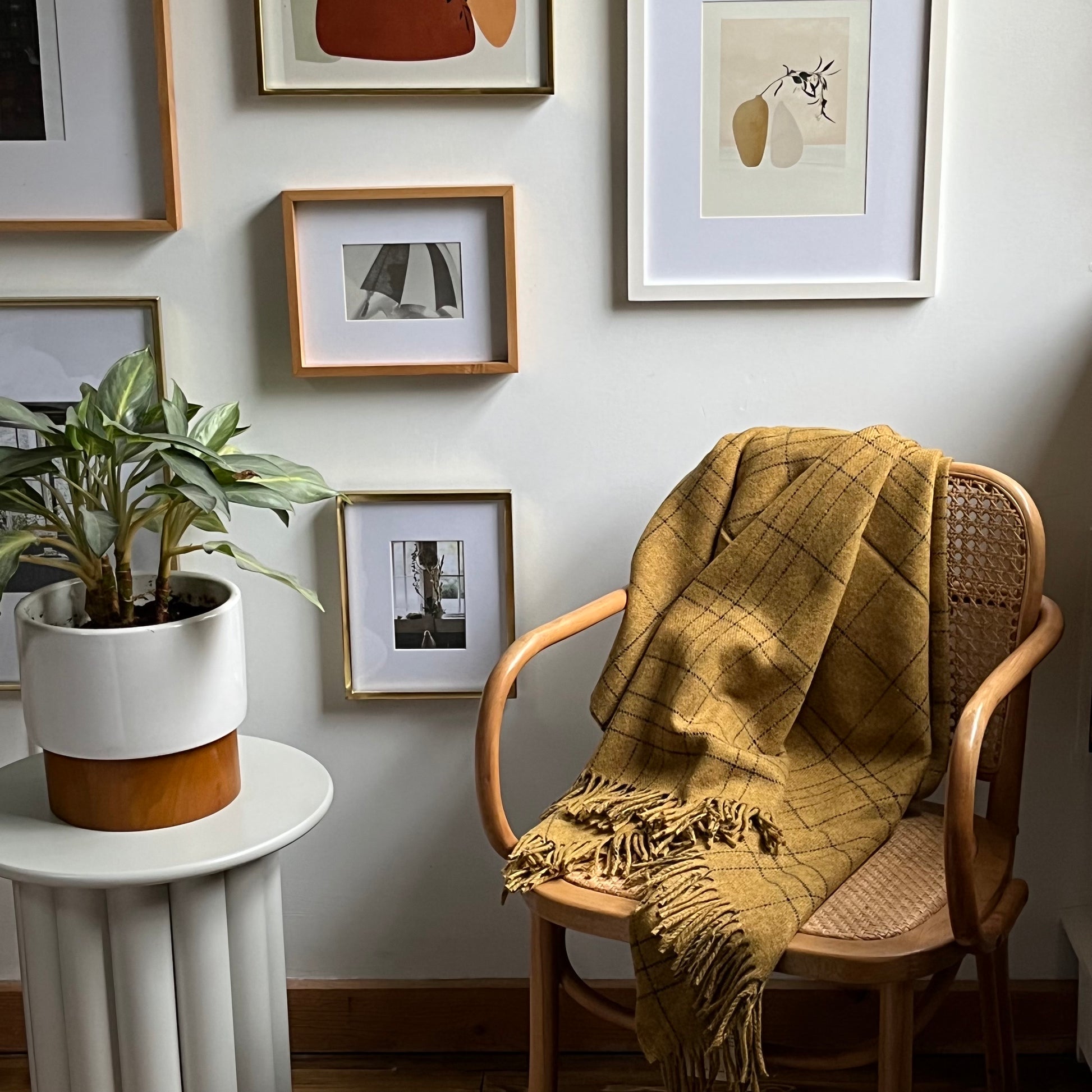 Cozy 100% Merino Lambswool throw blanket in honey color draped on armchair