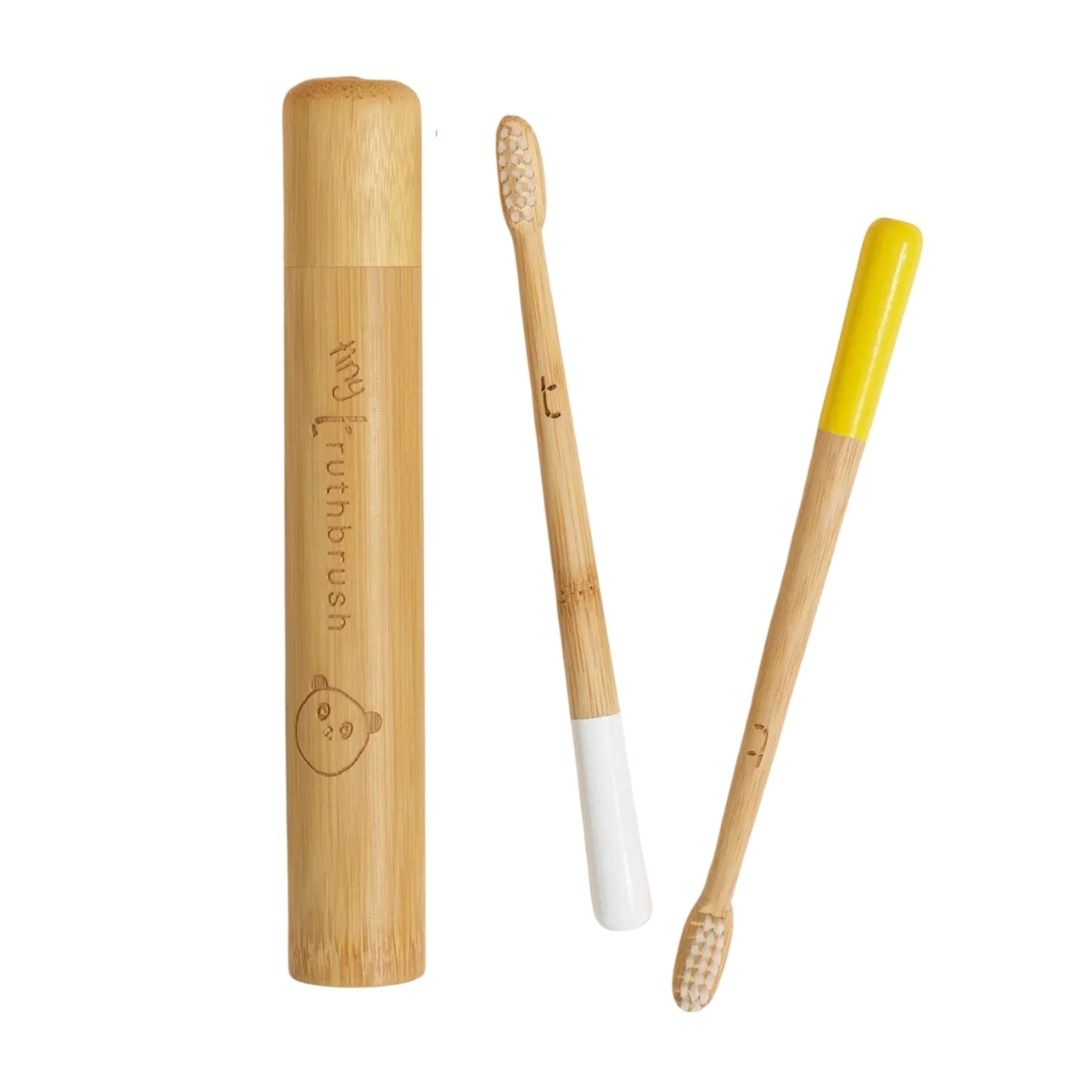 Children's bamboo toothbrush with Soft plant-based bristles in yellow and white with wooden travel cylinder (not included)