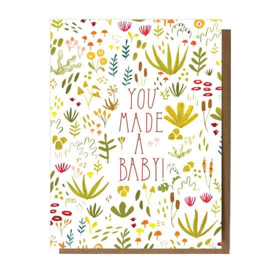 Folding card with illustrations of plants and mushrooms You Made a Baby! in the center